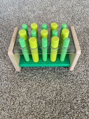 Lovevery Wooden Peg Toy with Green and Pegs